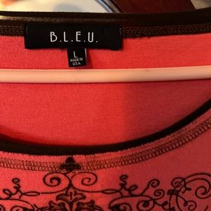 Women top size large orange with black stitching